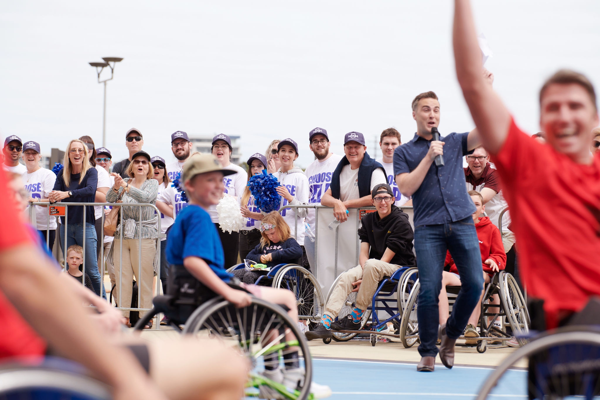 People in group setting including wheelchairs for a charity telephon