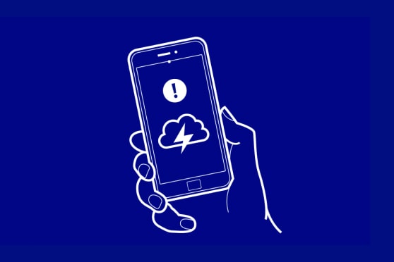 Illustration of a hand holding a phone with weather alert notification on a blue background